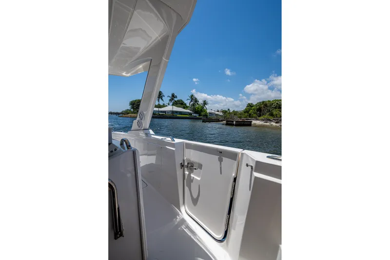 Slide: The Image of 2024 Tiara Yachts 38 LS boat deck with scenic waterfront view. - 33