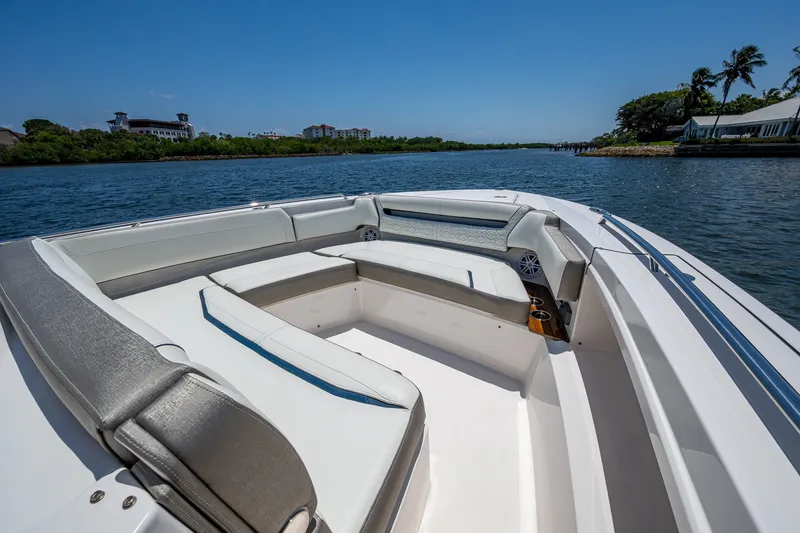 Slide: The Image of 2024 Tiara Yachts 38 LS boat interior with luxurious seating on a sunny day. - 16