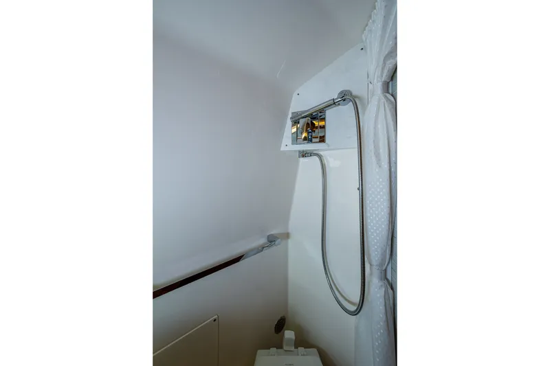 Slide: The Image of 2024 Tiara Yachts 38 LS shower area with modern fixtures and sleek design. - 47