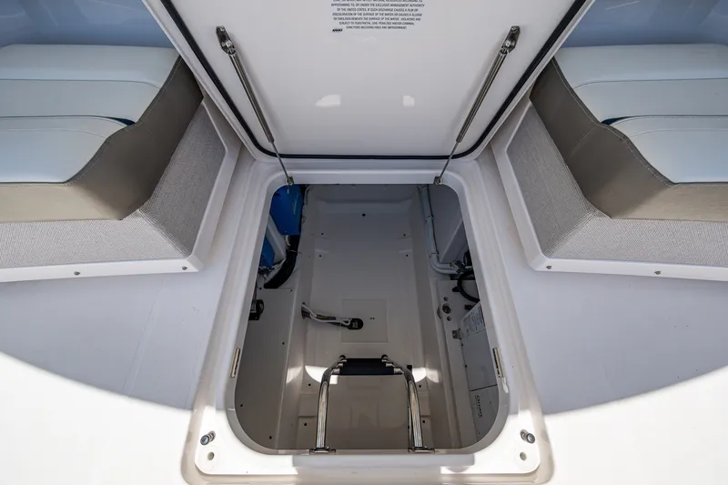 Slide: The Image of 2024 Tiara Yachts 38 LS storage compartment with open hatch and seating. - 35