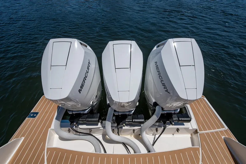 Slide: The Image of 2024 Tiara Yachts 38 LS with triple Mercury outboard engines on water. - 39