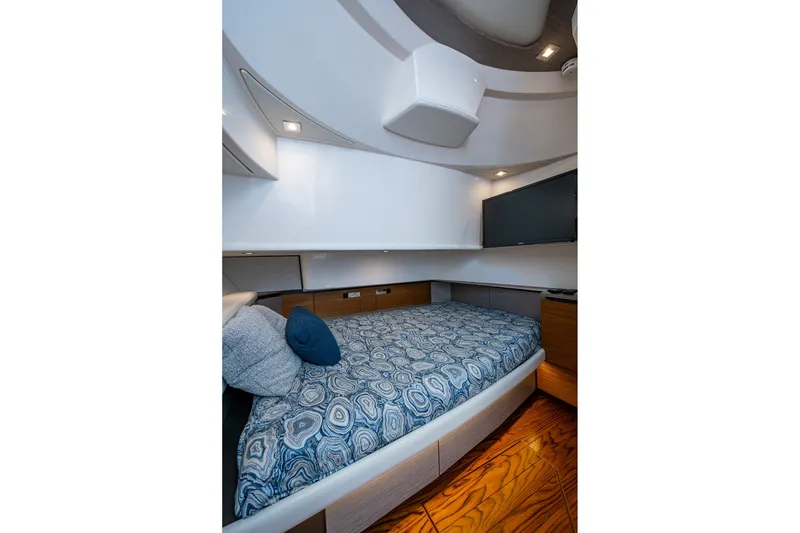 Slide: The Image of Luxurious cabin interior of 2024 Tiara Yachts 38 LS with stylish bedding and modern design. - 42