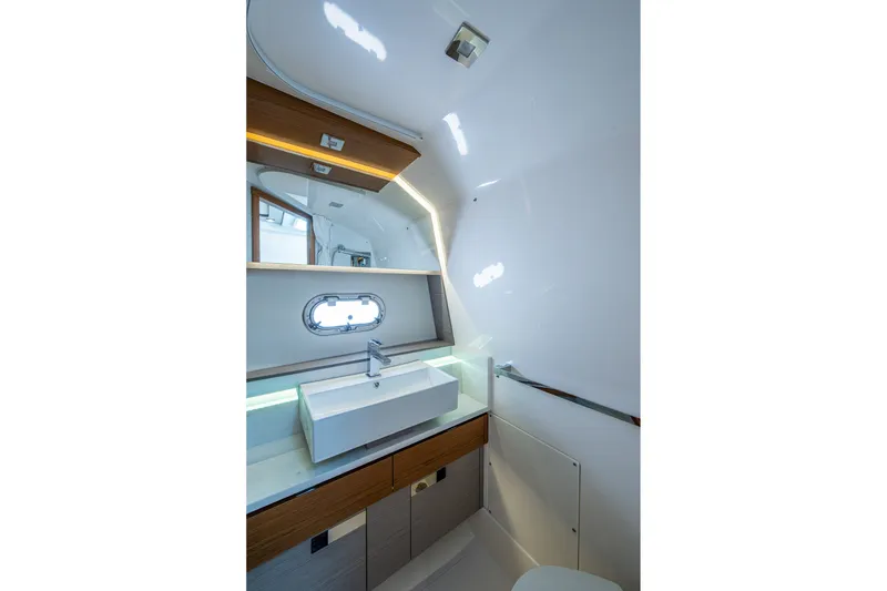Slide: The Image of Luxurious bathroom interior of 2024 Tiara Yachts 38 LS with modern sink and mirror. - 45