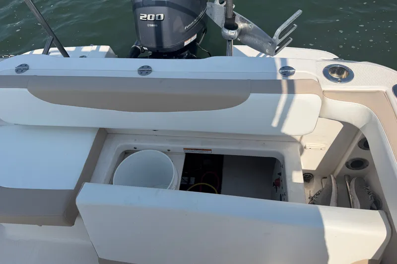 Slide: The Image of 2018 Robalo R222 Center Console boat with Yamaha 200 engine, open storage compartment. - 34