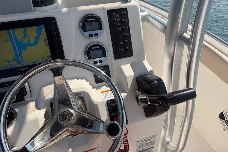 Slide: The Image of 2018 Robalo R222 Center Console dashboard with Garmin navigation and Yamaha controls. - 22