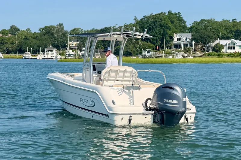 Slide: The Image of 2018 Robalo R222 Center Console boat with Yamaha engine on calm water. - 9