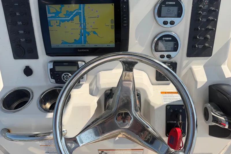 Slide: The Image of Steering console of 2018 Robalo R222 Center Console boat with Garmin navigation display. - 30