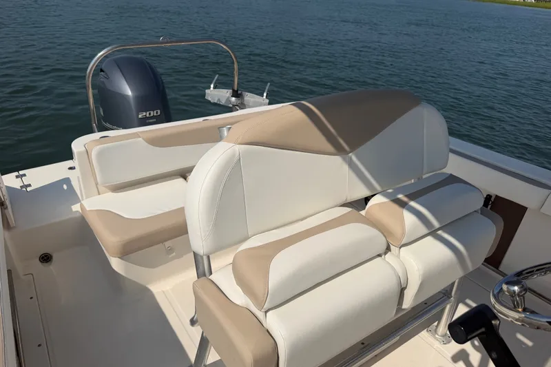 Slide: The Image of 2018 Robalo R222 Center Console boat interior with seating and Yamaha 200 engine. - 23