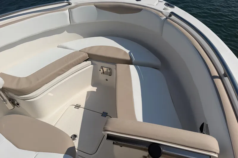Slide: The Image of 2018 Robalo R222 Center Console boat interior with cushioned seating and storage. - 15
