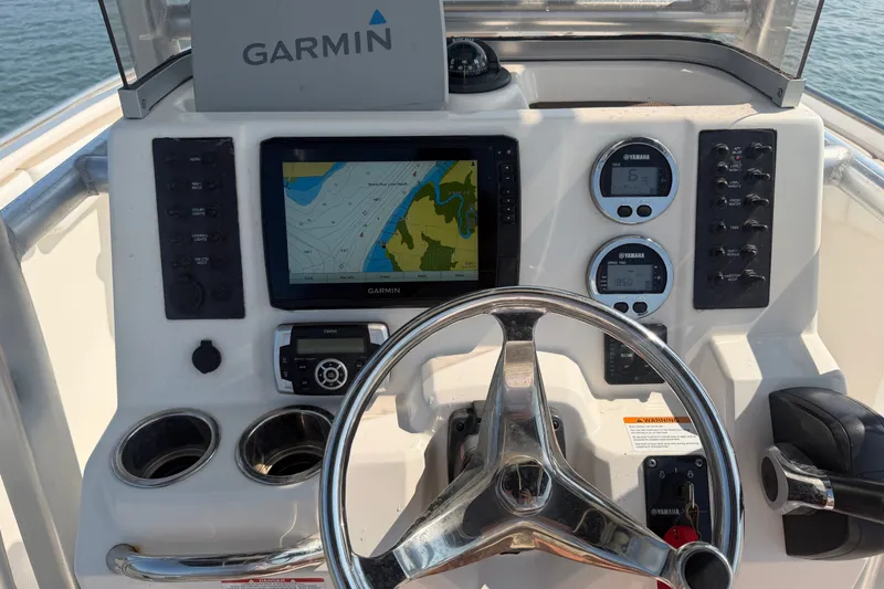 Slide: The Image of 2018 Robalo R222 Center Console dashboard with Garmin navigation and Yamaha gauges. - 21