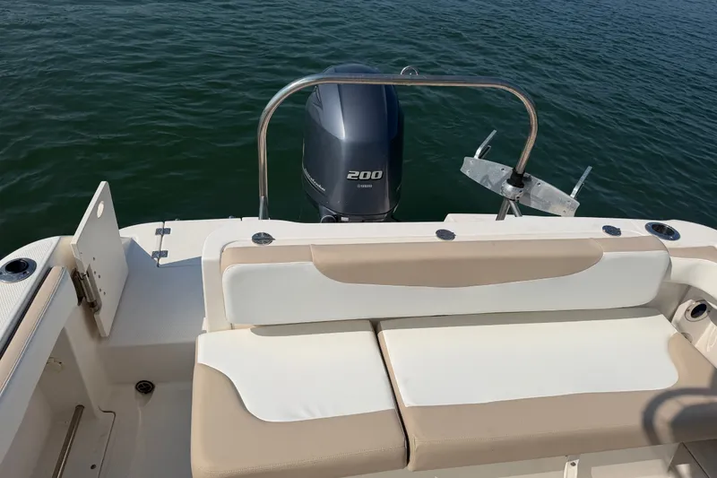 Slide: The Image of 2018 Robalo R222 Center Console boat with Yamaha 200 engine on calm water. - 24