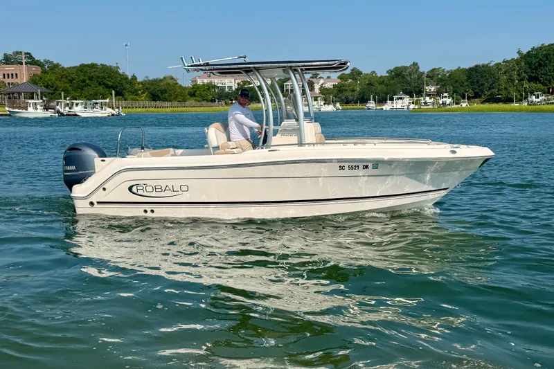 Slide: The Image of 2018 Robalo R222 Center Console boat cruising on a sunny day. - 5
