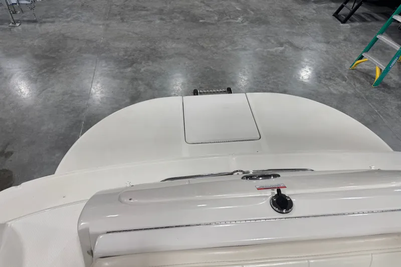 Slide: The Image of 2008 Sea Ray 240 Sundeck boat interior with swim platform in a showroom. - 10