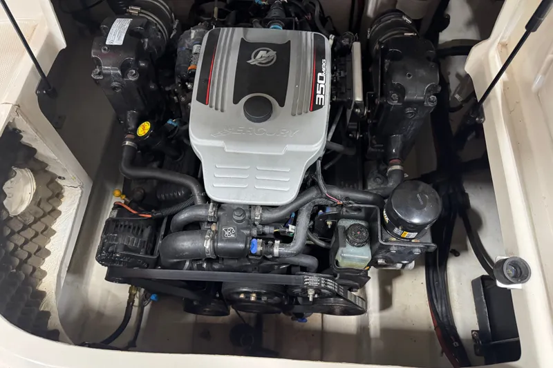 Slide: The Image of Engine compartment of a 2008 Sea Ray 240 Sundeck boat, featuring a 350 MAG engine. - 12