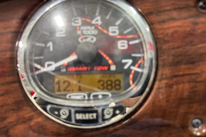 Slide: The Image of Close-up of 2008 Sea Ray 240 Sundeck tachometer displaying RPM and digital readings. - 11