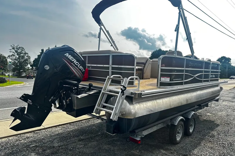 Slide: The Image of 2018 Berkshire Pontoon boat with Mercury outboard motor on a trailer. - 3