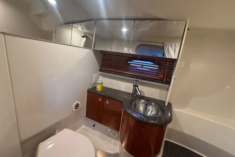Slide: The Image of Luxurious bathroom interior of 2009 Formula 400 Super Sport yacht with sink and mirror. - 23