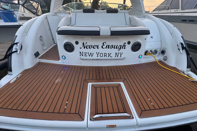 Slide: The Image of 2009 Formula 400 Super Sport boat with teak deck, named "Never Enough," docked in New York, NY. - 34