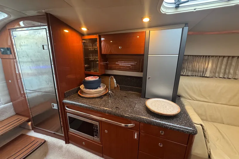 Slide: The Image of Luxurious 2009 Formula 400 Super Sport yacht interior with modern kitchen amenities. - 25