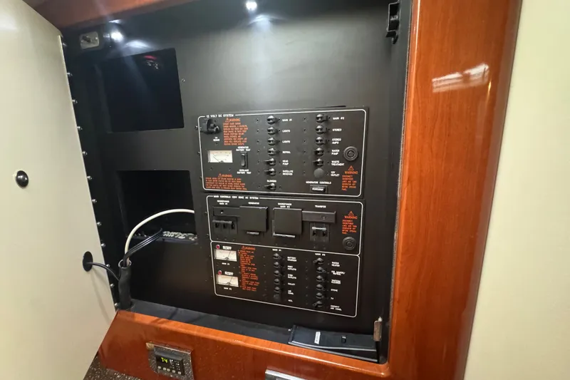 Slide: The Image of Electrical panel inside a 2009 Formula 400 Super Sport boat, featuring switches and controls. - 32