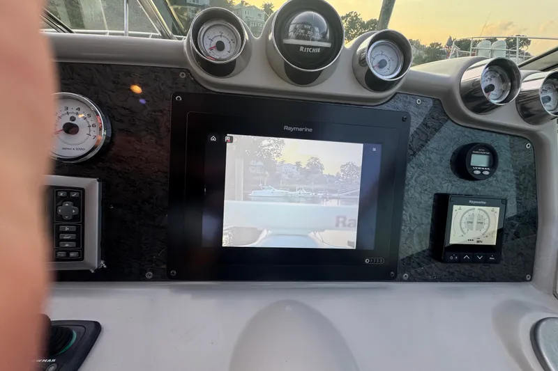 Slide: The Image of Dashboard of a 2009 Formula 400 Super Sport boat with navigation instruments. - 37