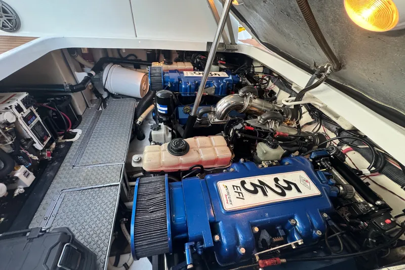 Slide: The Image of Engine compartment of a 2009 Formula 400 Super Sport boat, featuring dual Mercury EFI engines. - 41