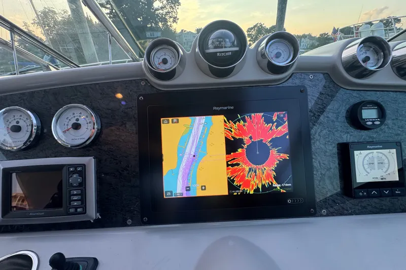 Slide: The Image of Dashboard of a 2009 Formula 400 Super Sport boat with navigation and control instruments. - 33