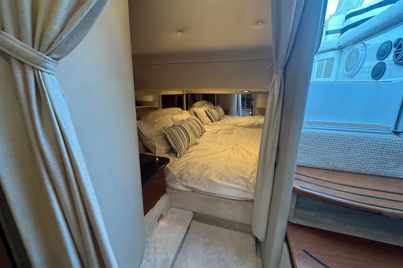 Slide: The Image of Interior cabin of a 2009 Formula 400 Super Sport yacht with cozy bedding and elegant design. - 19