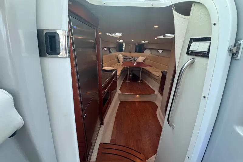 Slide: The Image of Interior view of 2009 Formula 400 Super Sport yacht with luxurious seating and wooden flooring. - 18