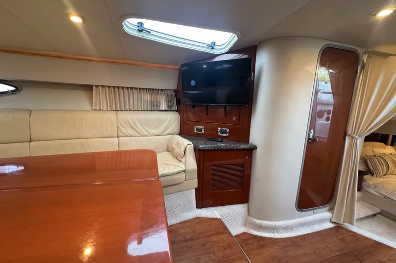 Slide: The Image of Interior of a 2009 Formula 400 Super Sport yacht with leather seating and TV. - 28