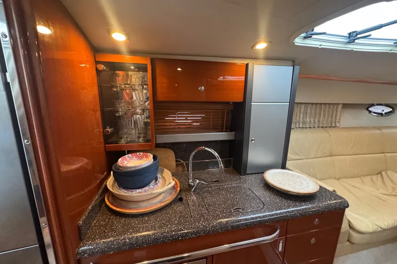 Slide: The Image of Luxurious 2009 Formula 400 Super Sport yacht interior with kitchenette and seating area. - 27