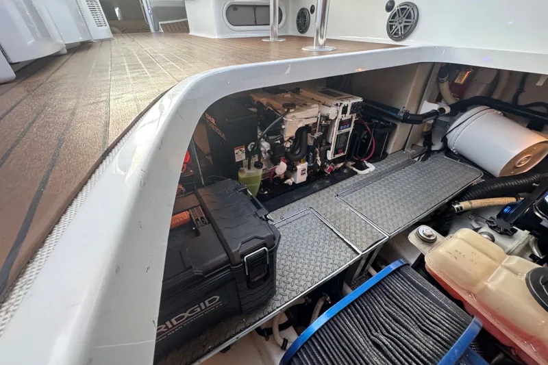 Slide: The Image of Engine compartment of a 2009 Formula 400 Super Sport boat, showcasing mechanical components. - 42