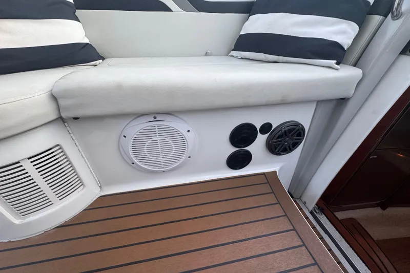Slide: The Image of Interior of a 2009 Formula 400 Super Sport boat with speakers and striped cushions. - 36