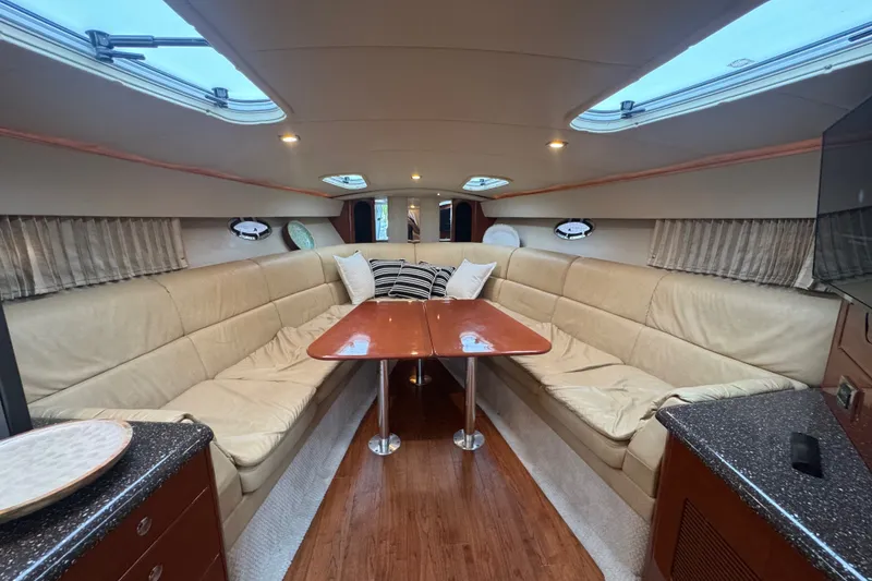 Slide: The Image of Luxurious interior of 2009 Formula 400 Super Sport yacht with plush seating and wooden table. - 24