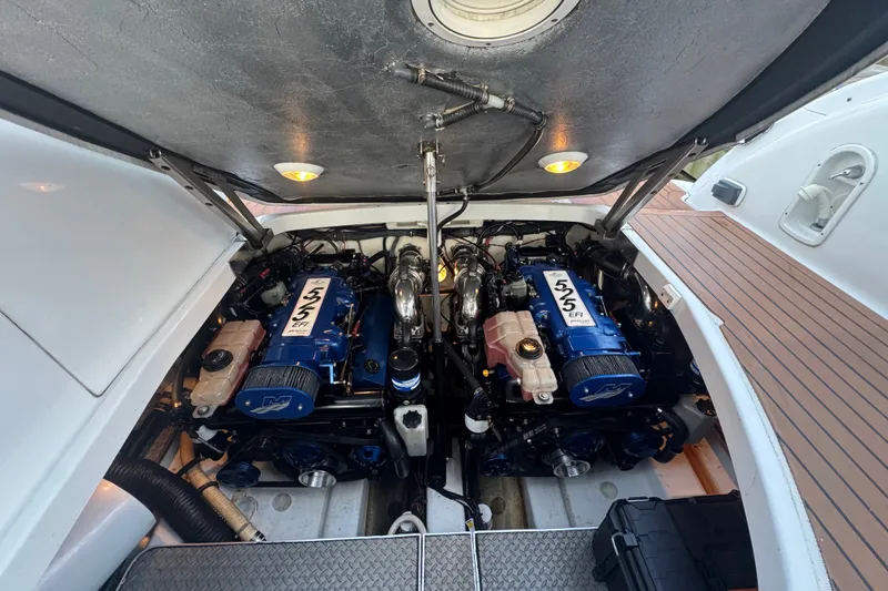 Slide: The Image of Engine compartment of a 2009 Formula 400 Super Sport boat, showcasing dual engines. - 39