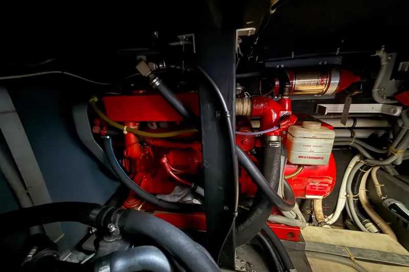 Slide: The Image of Engine room of 1986 Sea Ray 410 Aft Cabin with visible Westerbeke generator. - 56