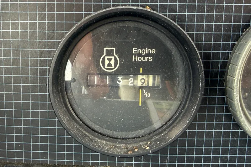 Slide: The Image of Engine hour meter showing 1132.9 hours on 1986 Sea Ray 410 Aft Cabin. - 13