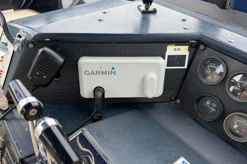 Slide: The Image of Control panel of a 1986 Sea Ray 410 Aft Cabin with Garmin device and gauges. - 14