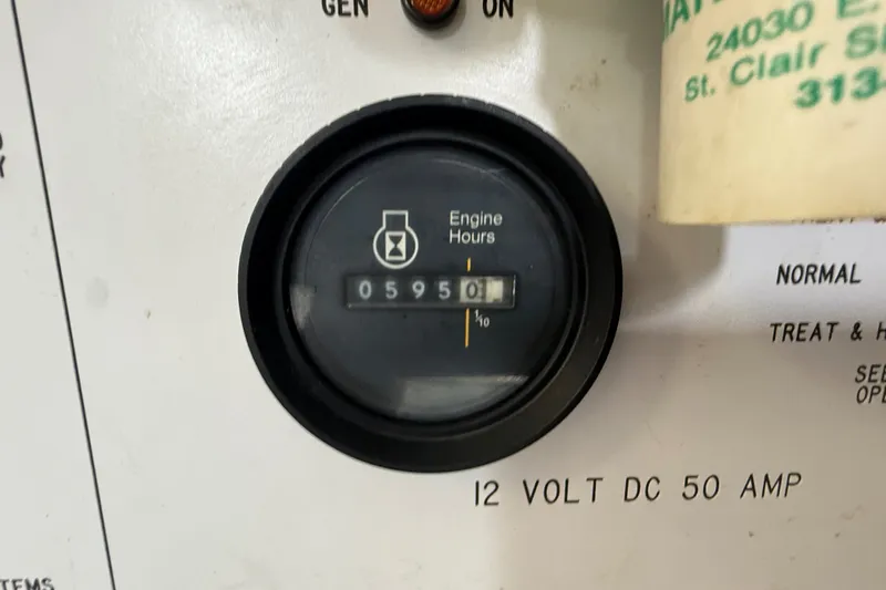 Slide: The Image of Engine hour meter showing 595.1 hours on a 1986 Sea Ray 410 Aft Cabin. - 52