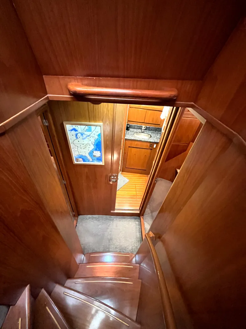 Slide: The Image of A wooden staircase leads to a cozy interior with a map on the wall. - 24