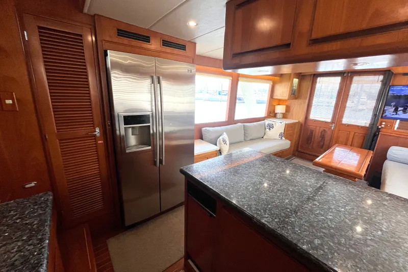 Slide: The Image of Interior of a 2002 Grand Alaskan 53 RPH with modern kitchen and cozy living area. - 11