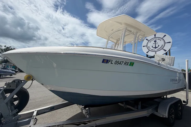 Slide: The Image of 2019 Robalo R222 Center Console boat on trailer under cloudy sky. - 9