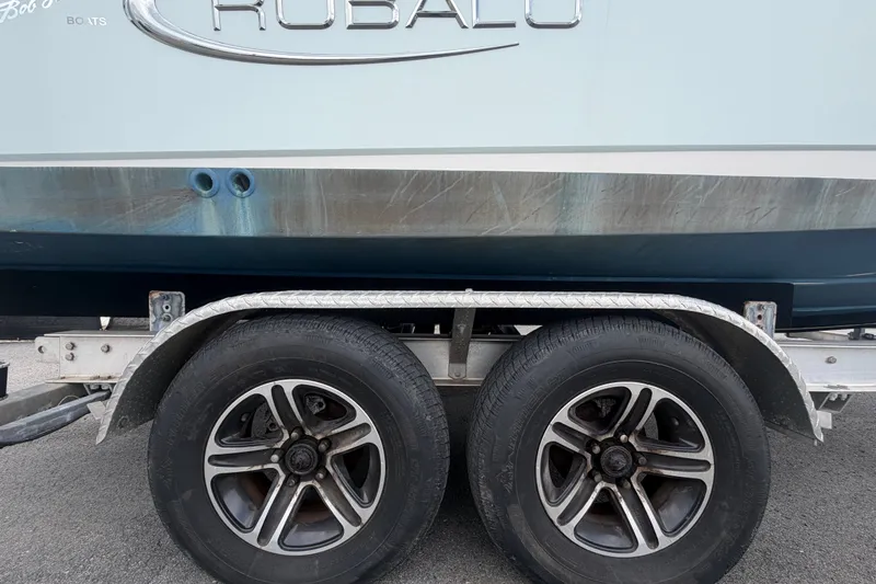 Slide: The Image of 2019 Robalo R222 Center Console boat on trailer with dual wheels. - 75