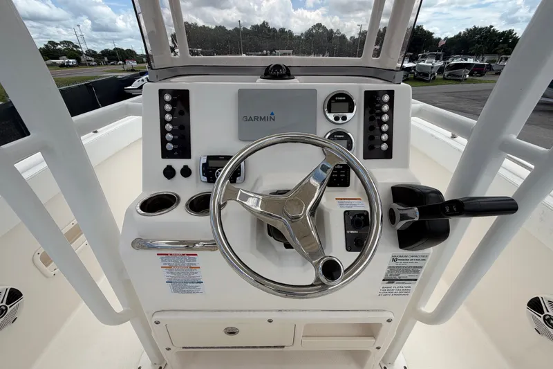 Slide: The Image of 2019 Robalo R222 Center Console helm with Garmin navigation system and controls. - 21