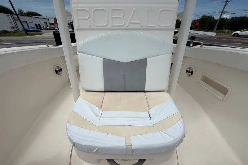 Slide: The Image of 2019 Robalo R222 Center Console boat seat with white and gray upholstery. - 49