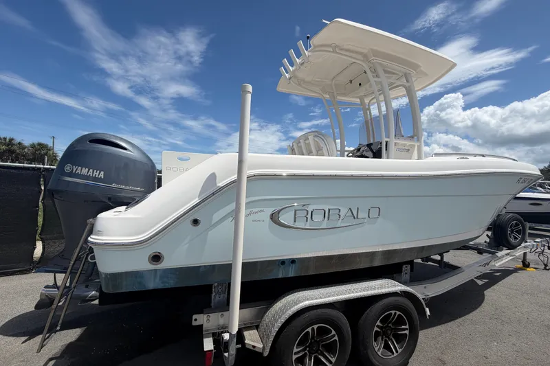Slide: The Image of 2019 Robalo R222 Center Console boat on trailer with Yamaha engine. - 2