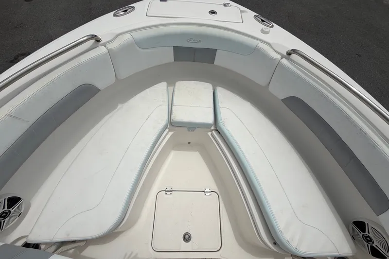 Slide: The Image of The image shows the bow area of a 2019 Robalo R222 Center Console boat with seating. - 33