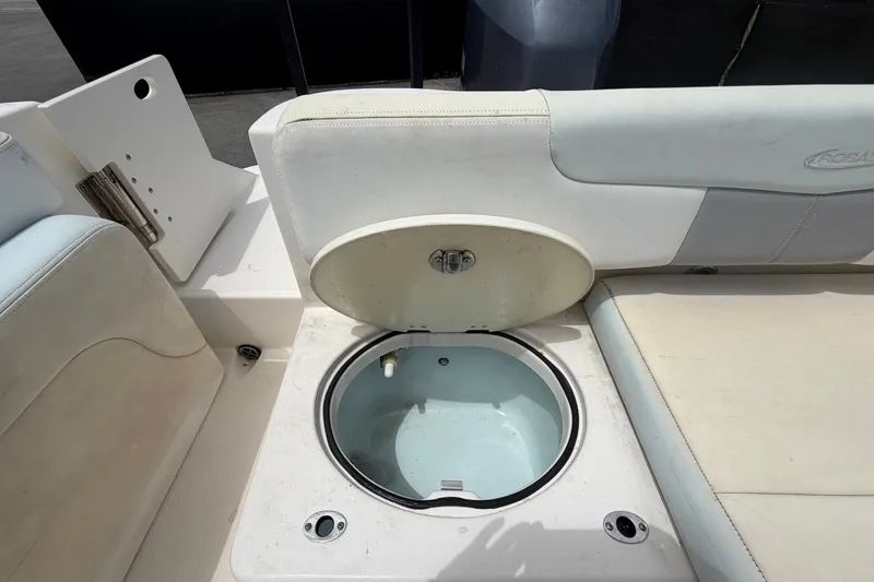 Slide: The Image of 2019 Robalo R222 Center Console boat with open storage compartment. - 60