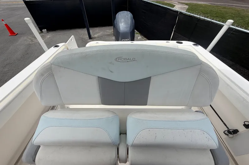 Slide: The Image of 2019 Robalo R222 Center Console boat seating with engine view. - 56