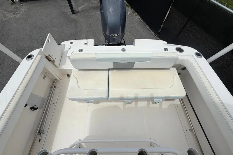 Slide: The Image of 2019 Robalo R222 Center Console boat interior with seating and outboard motor. - 57